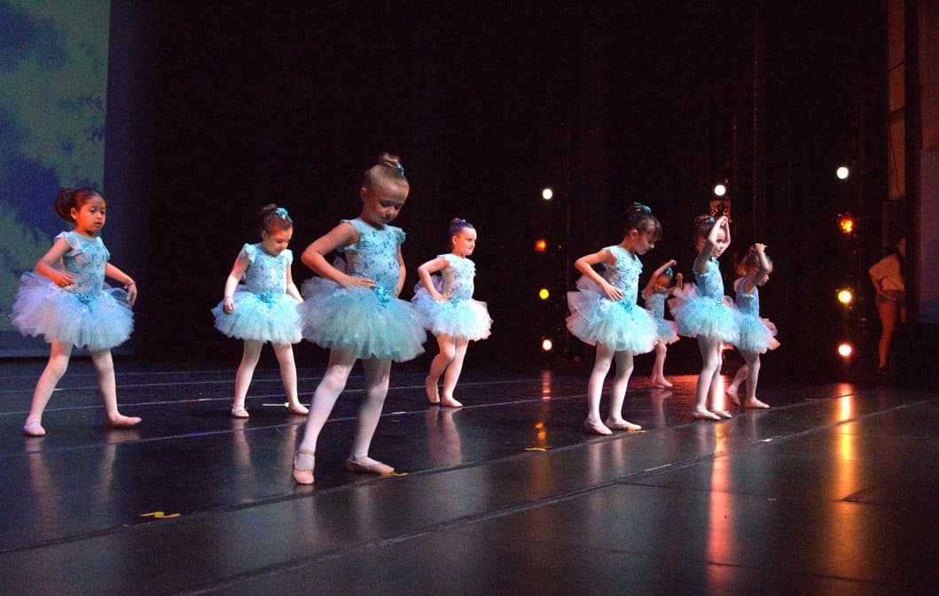 Young dancers practicing ballet together
